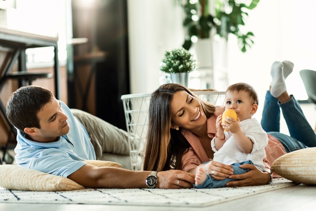 family with a small child smiling