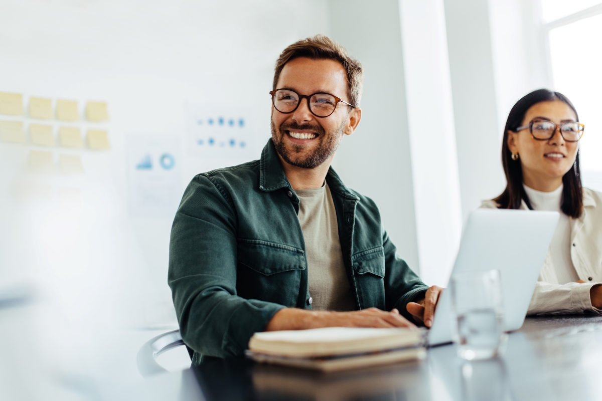 man in office smiling